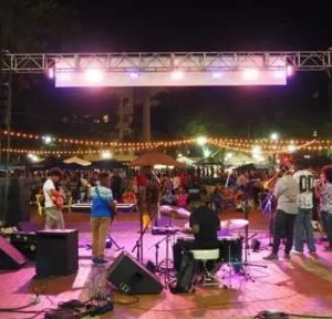 Young men performing in a band on stage